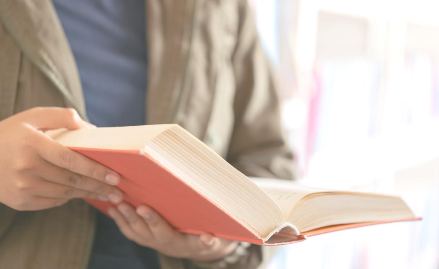 Savings jar with coins and budgeting materials