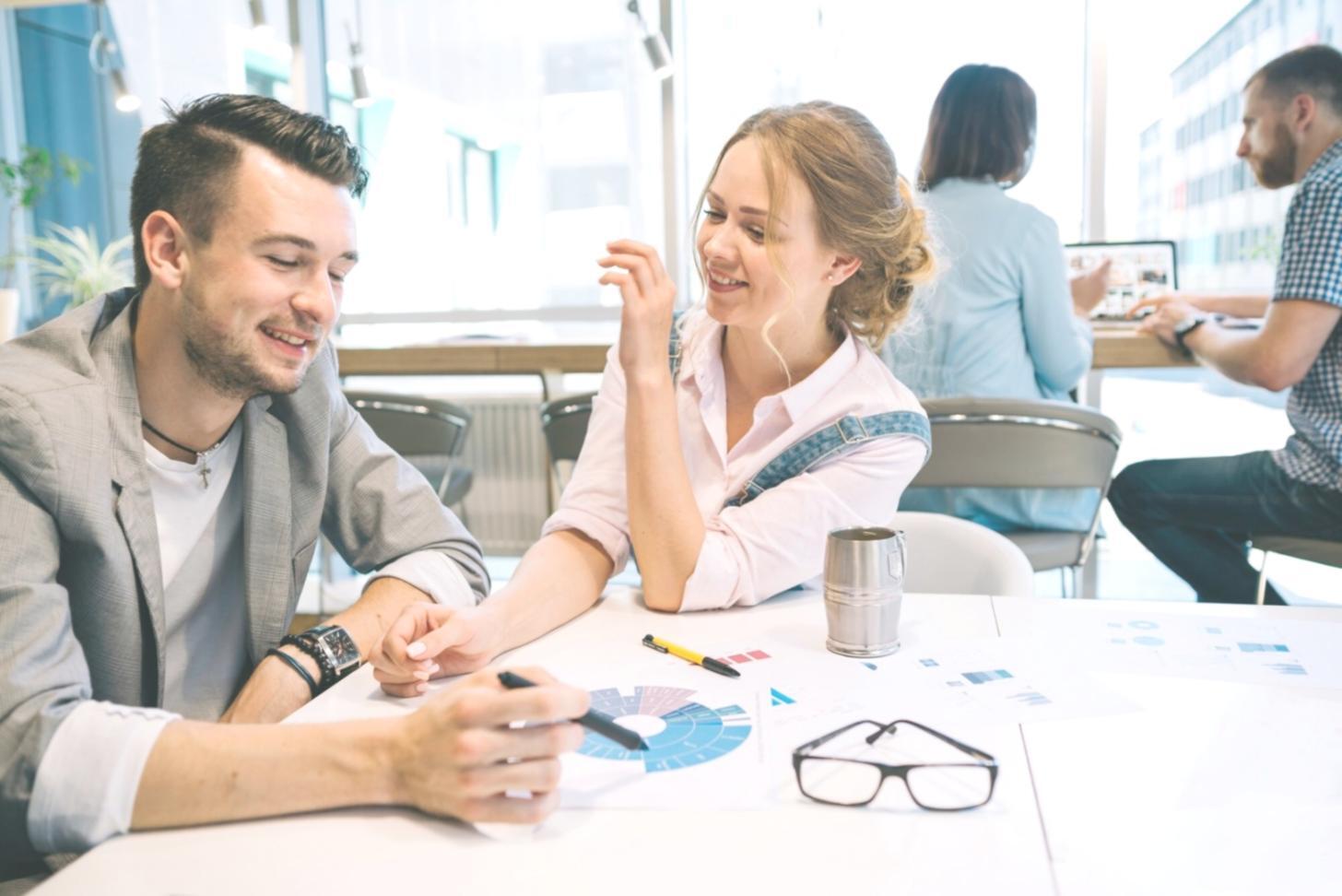 Interactive budgeting workshop with participants working on personal financial plans