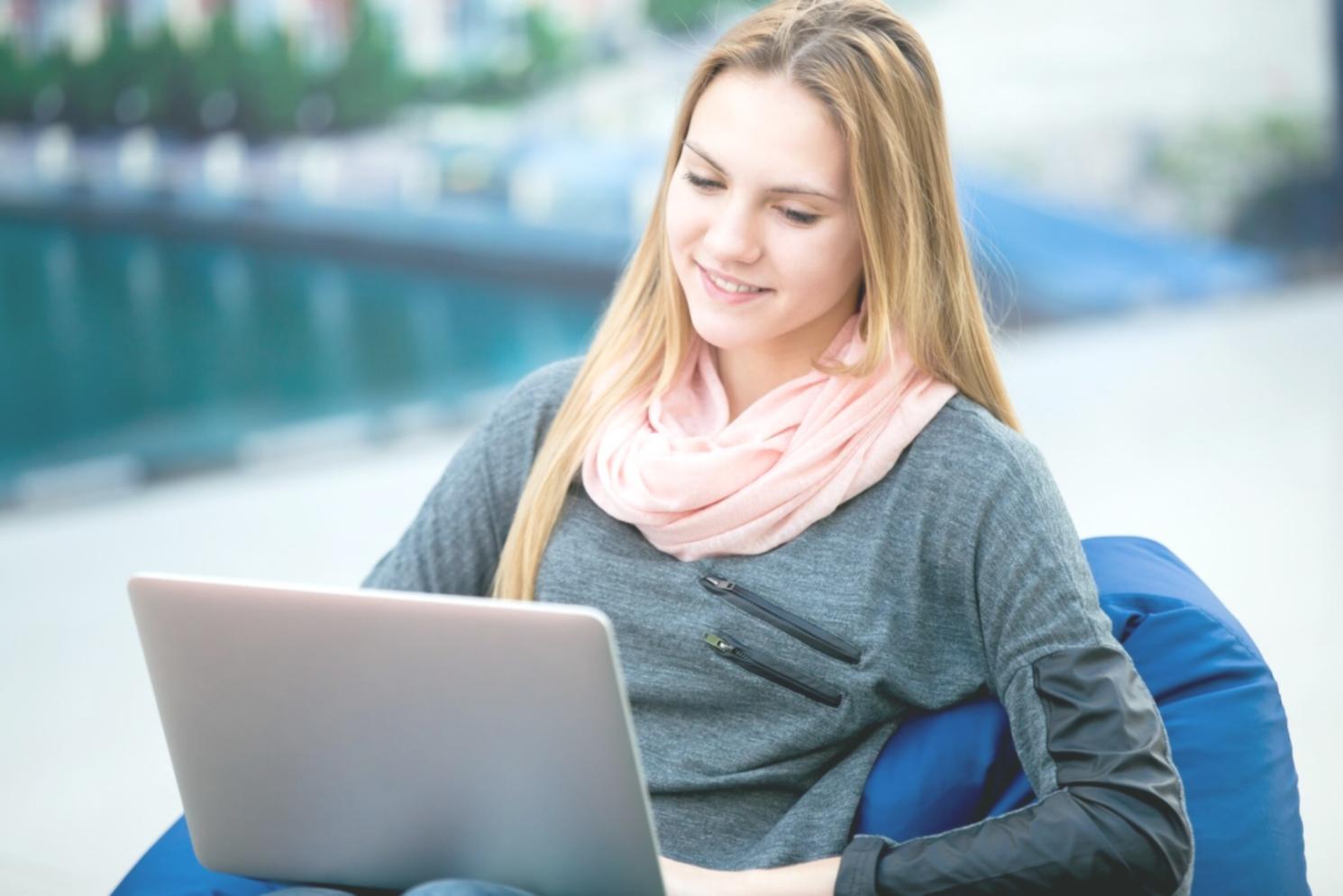 Person reviewing financial documents and planning budget at desk